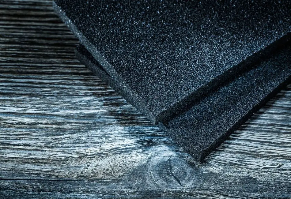Black Abrasive Cleaning Pad On Wooden Surface