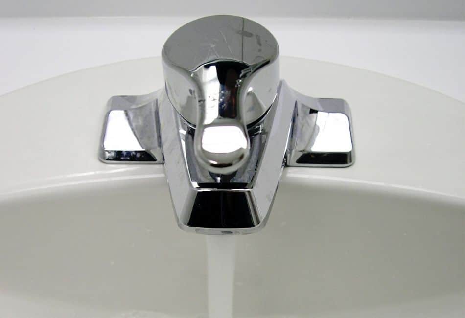 Bathroom Sink Filled With Tap Water