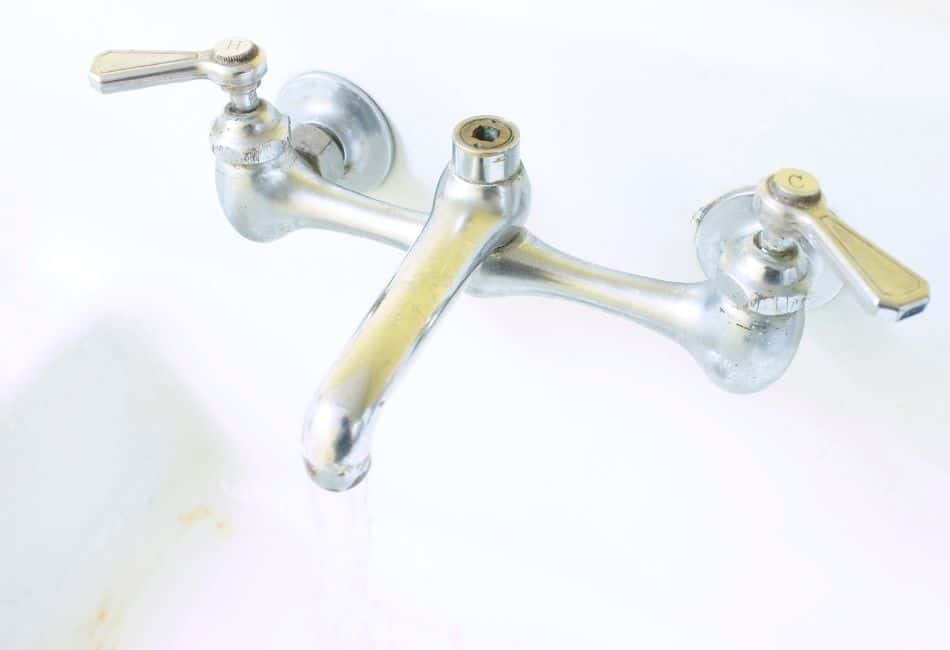 Bridge style cartridge bathroom sink faucet