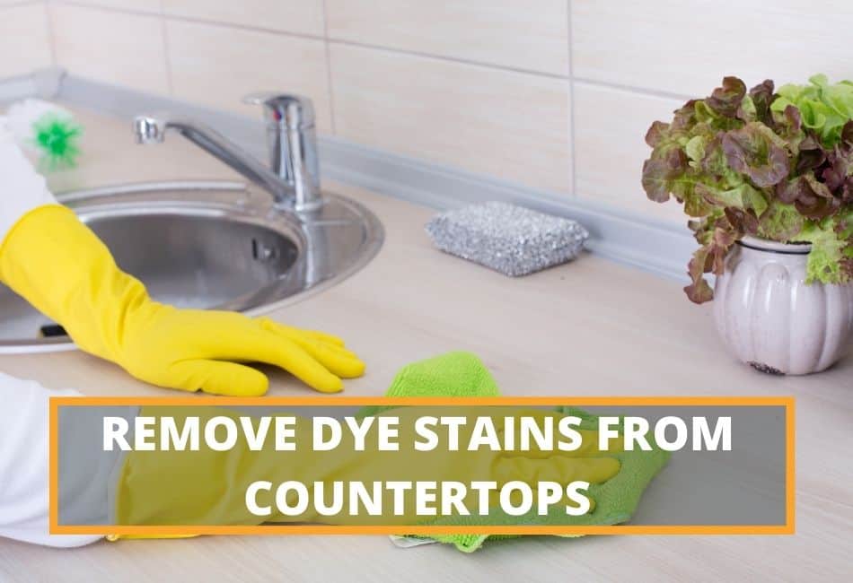 Man cleaning dye stains on laminate countertop
